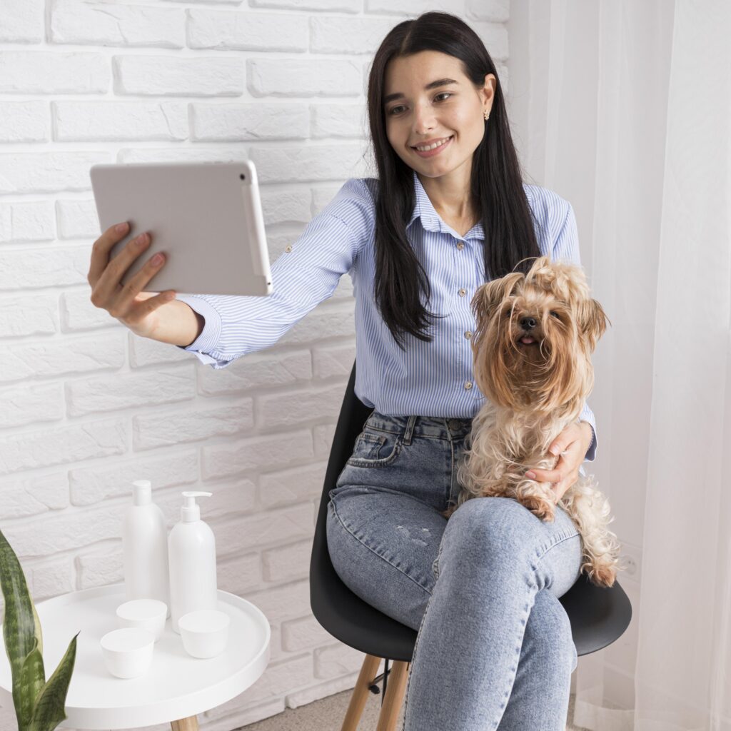 female-per-sitter-is-takeng-photos-with-a-dog